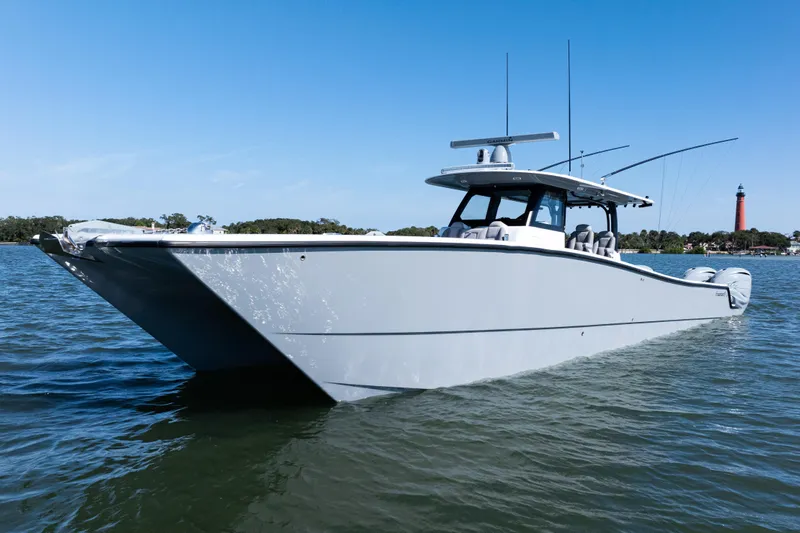  Yacht Photos Pics 2024 Freeman 47 boat on water with clear blue sky background.