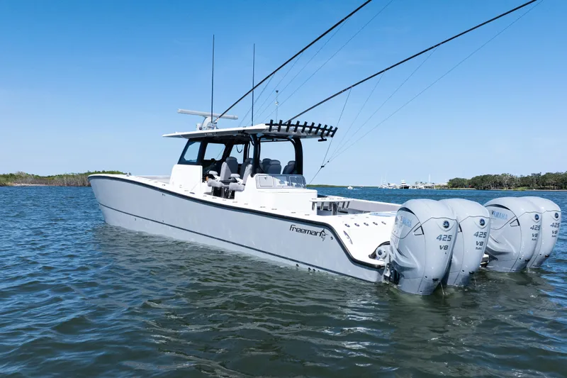  Yacht Photos Pics 2024 Freeman 47 boat with quad Yamaha 425 V8 engines on calm water.