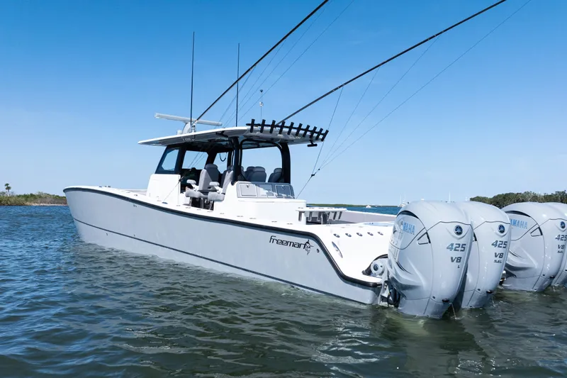  Yacht Photos Pics 2024 Freeman 47 boat with Yamaha 425 V8 engines on calm water.