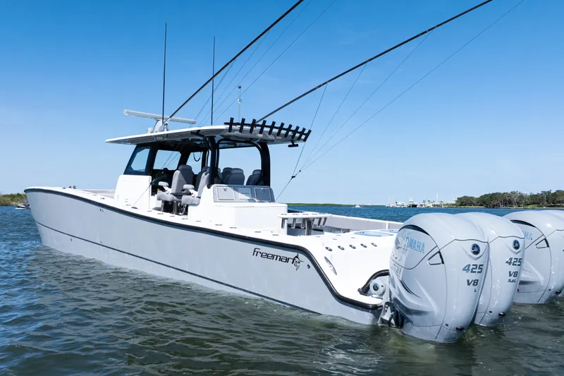  Yacht Photos Pics 2024 Freeman 47 boat with Yamaha engines on calm water.