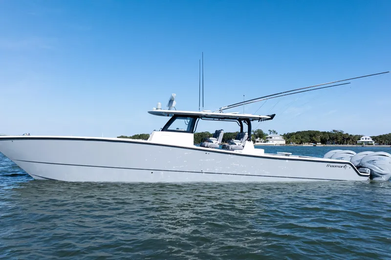  Yacht Photos Pics 2024 Freeman 47 boat on water, clear sky, side view.