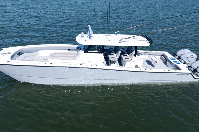  Yacht Photos Pics 2024 Freeman 47 boat on water, featuring sleek design and powerful engines.
