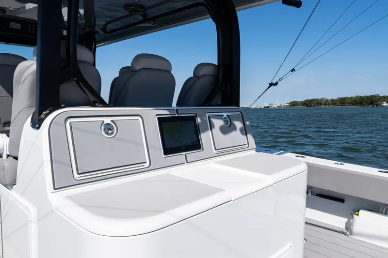  Yacht Photos Pics 2024 Freeman 47 boat interior with sleek seating and control panel on open water.