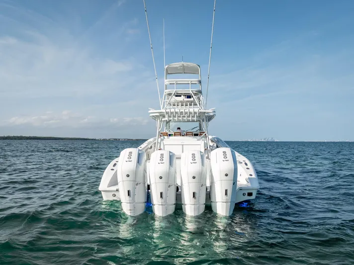  Yacht Photos Pics 2023 Yellowfin 54 boat with multiple outboard engines on open water.