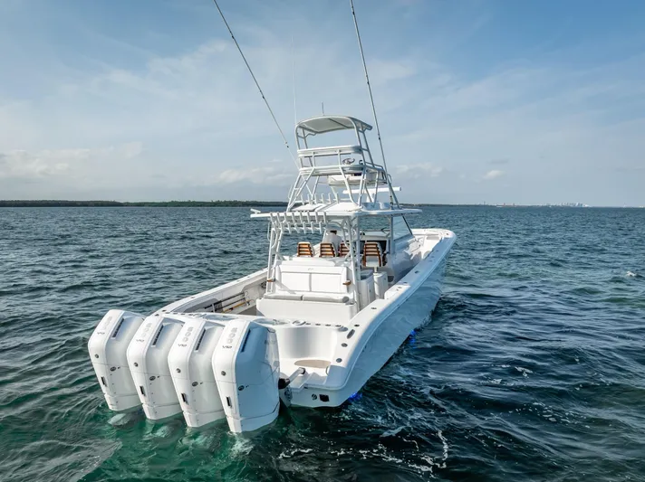  Yacht Photos Pics 2023 Yellowfin 54 boat with multiple outboard engines on open water.