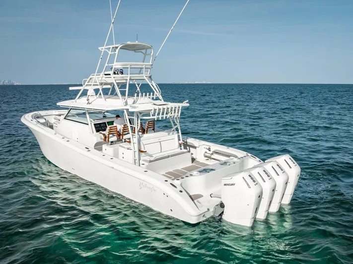  Yacht Photos Pics 2023 Yellowfin 54 boat with multiple outboard engines on open sea.