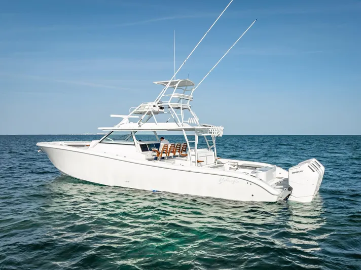  Yacht Photos Pics 2023 Yellowfin 54 boat on open sea under clear blue sky.
