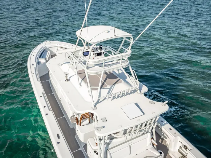  Yacht Photos Pics 2023 Yellowfin 54 boat on clear blue water, aerial view.