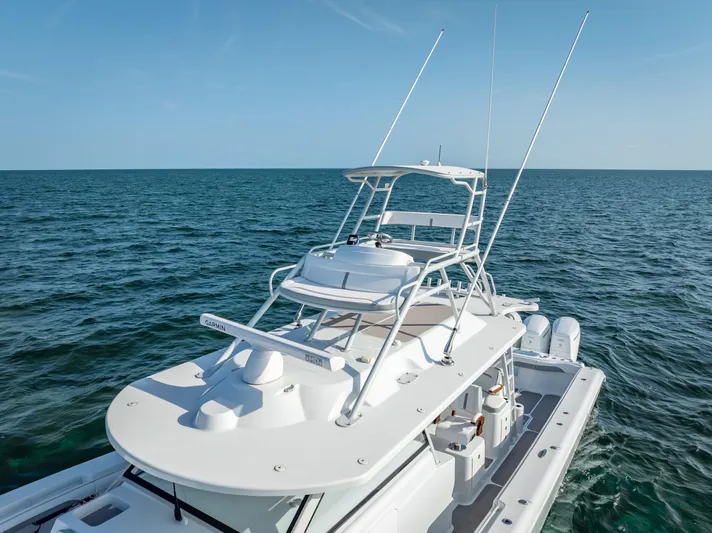  Yacht Photos Pics 2023 Yellowfin 54 boat on open sea, showcasing sleek design and advanced features.