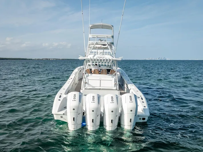  Yacht Photos Pics 2023 Yellowfin 54 boat with multiple engines on open water.