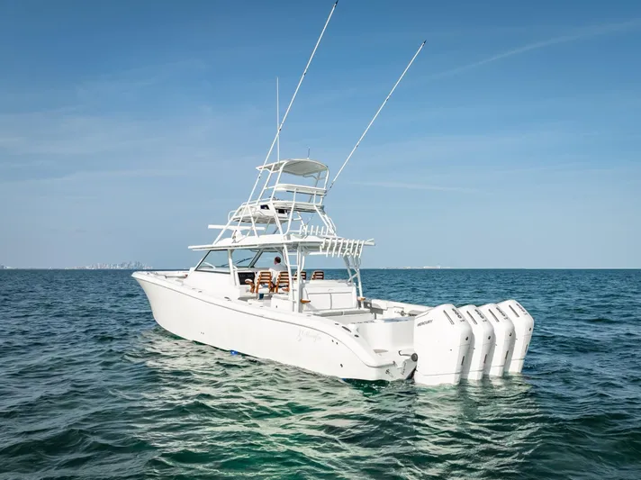  Yacht Photos Pics 2023 Yellowfin 54 boat on open sea with clear blue sky.