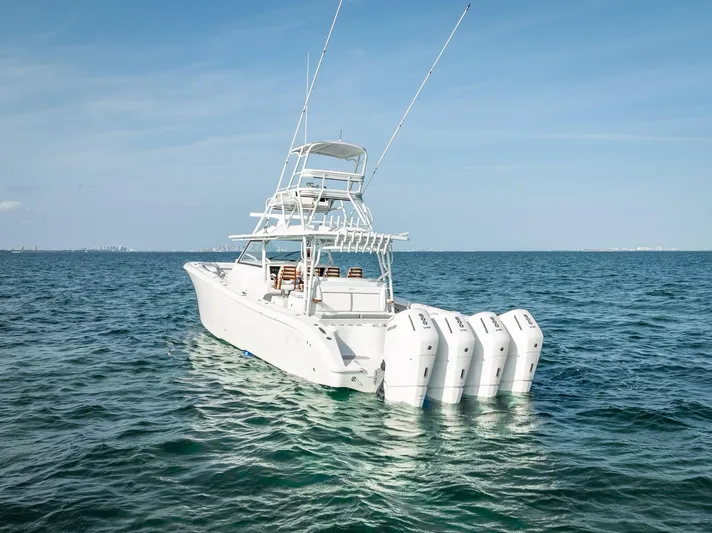 Yacht Photos Pics 2023 Yellowfin 54 boat with multiple engines on open water.