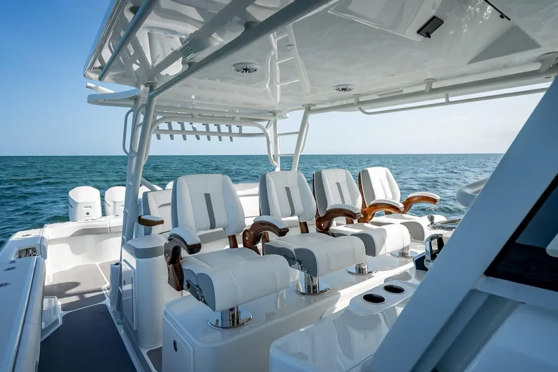  Yacht Photos Pics 2023 Yellowfin 54 boat interior with luxurious seating on open water.