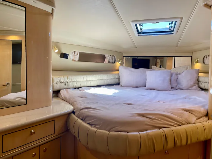 No Doubts IV Yacht Photos Pics Luxurious cabin interior of 1999 Sea Ray 500 Sundancer yacht with plush bedding.