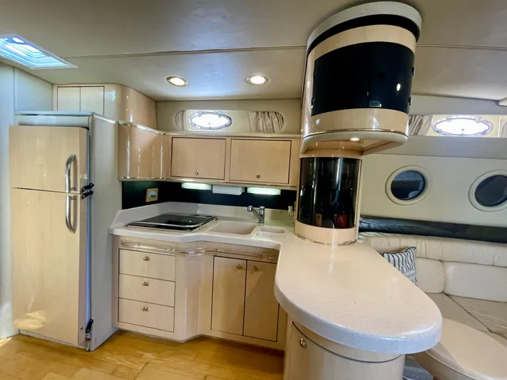 No Doubts IV Yacht Photos Pics Luxurious interior of 1999 Sea Ray 500 Sundancer yacht with modern kitchen amenities.
