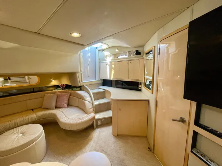 No Doubts IV Yacht Photos Pics Luxurious interior of a 1999 Sea Ray 500 Sundancer yacht with plush seating and modern amenities.