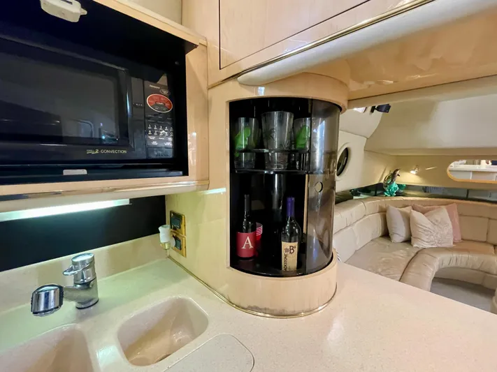 No Doubts IV Yacht Photos Pics Interior of 1999 Sea Ray 500 Sundancer yacht with kitchenette and lounge area.