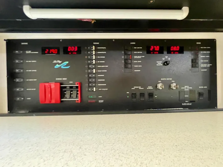 No Doubts IV Yacht Photos Pics Control panel of a 1999 Sea Ray 500 Sundancer boat with various switches and displays.