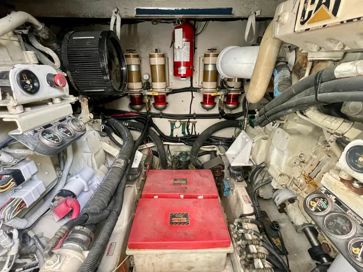 No Doubts IV Yacht Photos Pics Engine room of a 1999 Sea Ray 500 Sundancer with visible components and wiring.