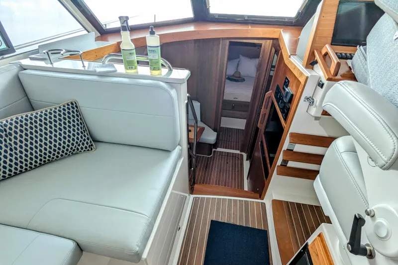  Yacht Photos Pics 2024 Back Cove 39O interior with modern seating and wooden accents.
