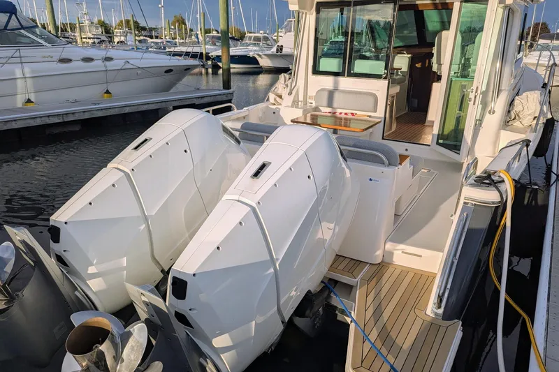  Yacht Photos Pics 2024 Back Cove 39O boat with dual outboard engines docked at marina.