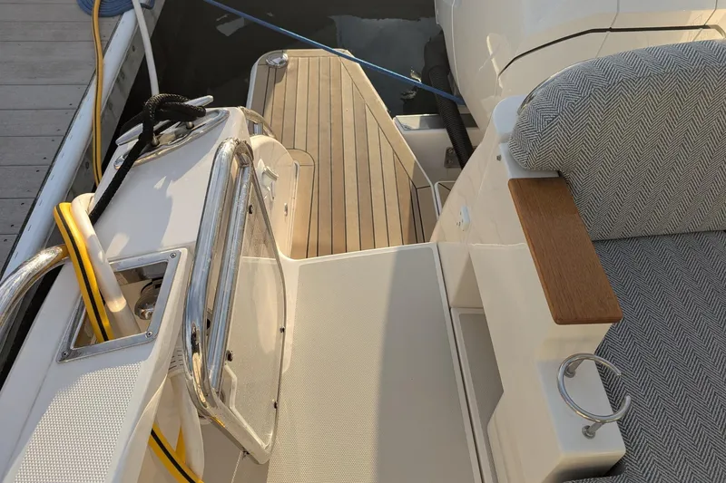  Yacht Photos Pics 2024 Back Cove 39O boat deck with seating and wooden accents.
