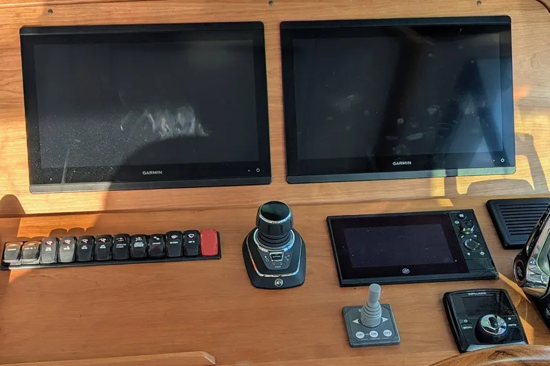  Yacht Photos Pics Control panel of 2024 Back Cove 39O boat with Garmin displays and navigation controls.