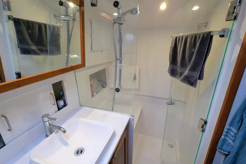  Yacht Photos Pics Modern bathroom in 2024 Back Cove 39O yacht with glass shower and sleek fixtures.