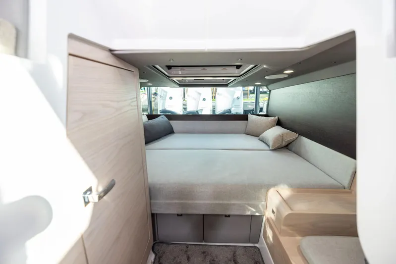  Yacht Photos Pics 2025 Axopar 45 Cross Top cabin interior with modern design and comfortable bedding.
