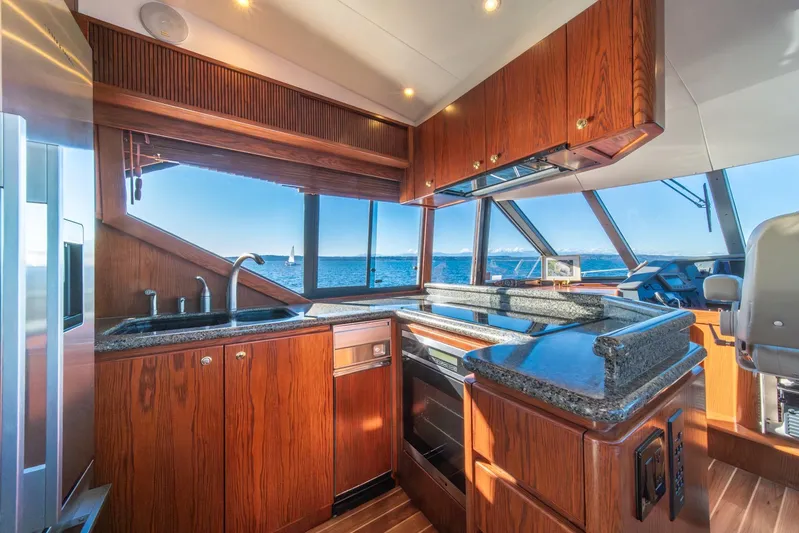 Esperanca Yacht Photos Pics Luxurious kitchen interior of 1998 West Bay 58 Sonship Pilothouse MY yacht with ocean view.