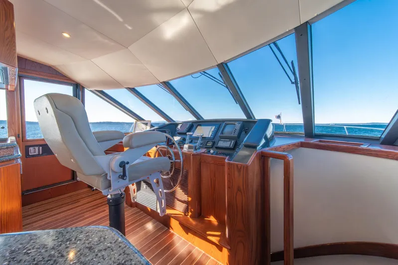 Esperanca Yacht Photos Pics Pilothouse interior of 1998 West Bay 58 Sonship, featuring helm and panoramic windows.