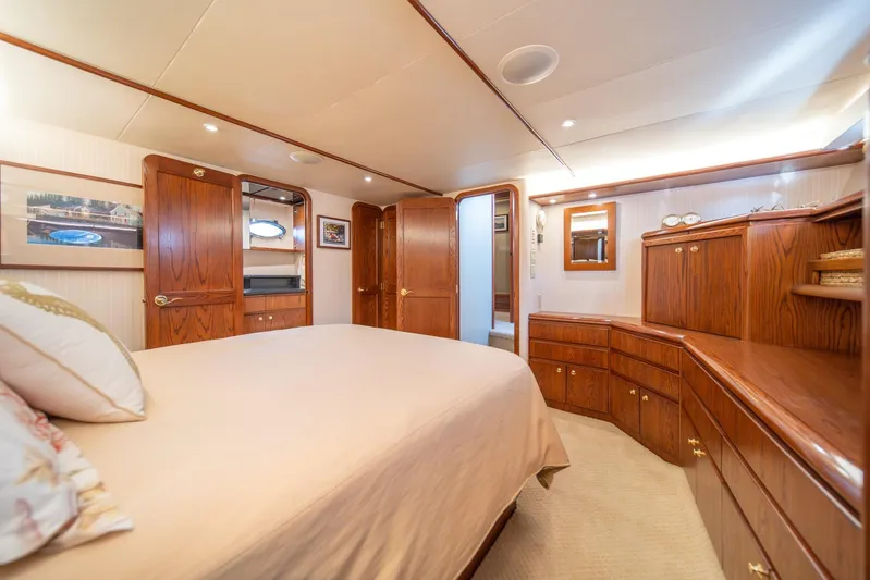 Esperanca Yacht Photos Pics Luxurious 1998 West Bay 58 Sonship Pilothouse MY bedroom with elegant wood cabinetry.