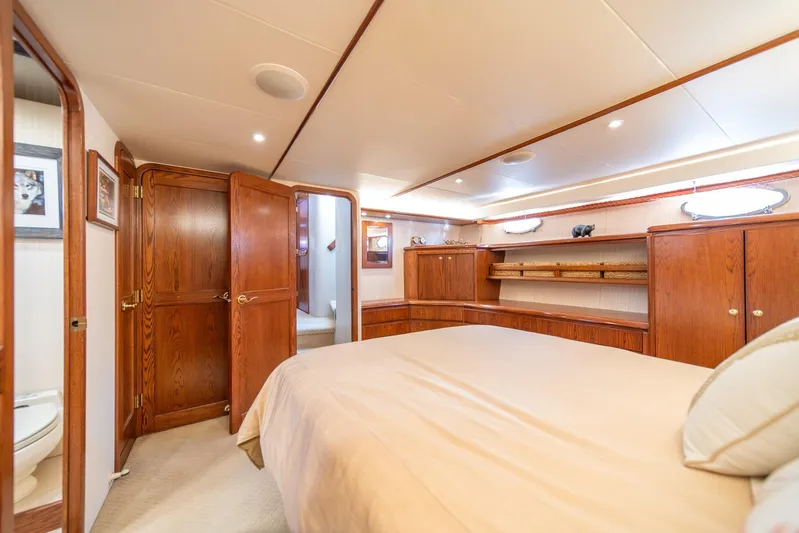 Esperanca Yacht Photos Pics Luxurious 1998 West Bay 58 Sonship Pilothouse MY bedroom with elegant wood cabinetry.