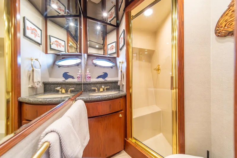 Esperanca Yacht Photos Pics Luxurious bathroom in 1998 West Bay 58 Sonship Pilothouse MY yacht with elegant fixtures.