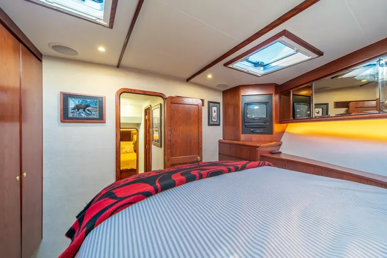 Esperanca Yacht Photos Pics Luxurious 1998 West Bay 58 Sonship Pilothouse MY bedroom with wood accents and skylight.