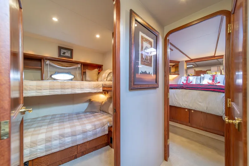 Esperanca Yacht Photos Pics 1998 West Bay 58 Sonship Pilothouse MY interior with cozy bunk beds and elegant bedroom.