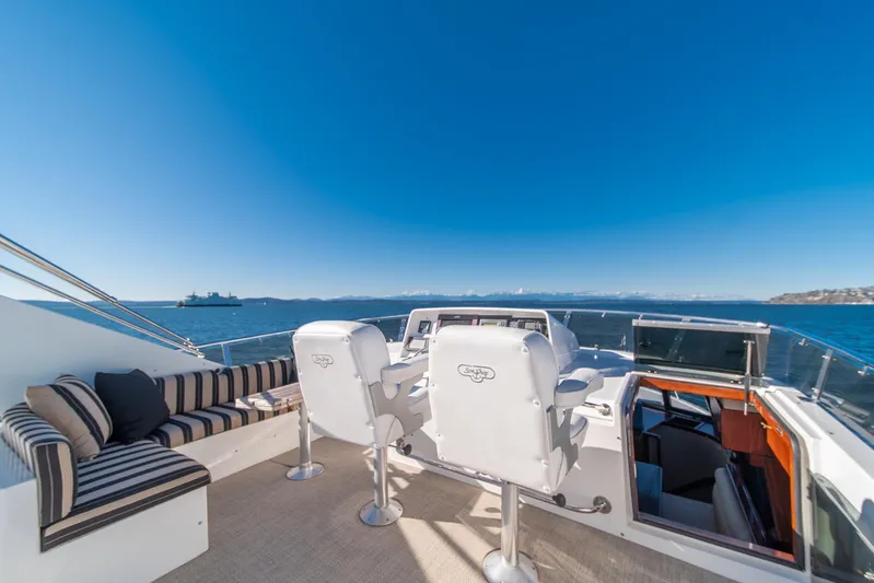 Esperanca Yacht Photos Pics 1998 West Bay 58 Sonship Pilothouse MY yacht deck with seating and ocean view.