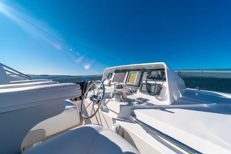 Esperanca Yacht Photos Pics Cockpit view of 1998 West Bay 58 Sonship Pilothouse MY under clear blue sky.
