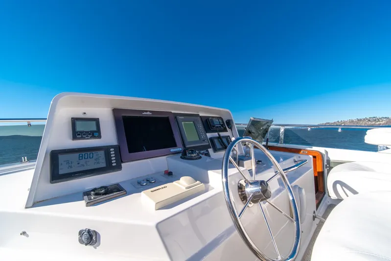 Esperanca Yacht Photos Pics Cockpit of 1998 West Bay 58 Sonship Pilothouse MY with navigation instruments and steering wheel.
