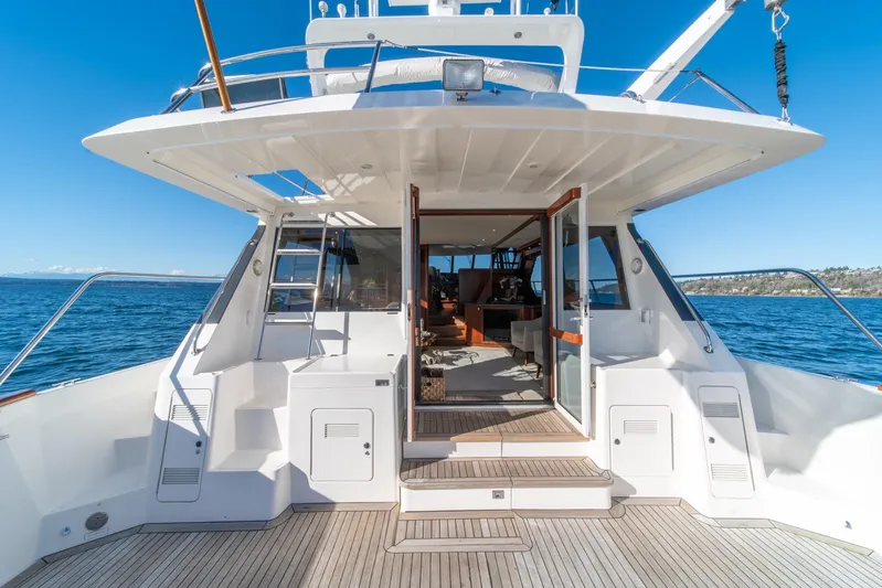 Esperanca Yacht Photos Pics 1998 West Bay 58 Sonship Pilothouse MY yacht, open deck view, sunny day, ocean backdrop.