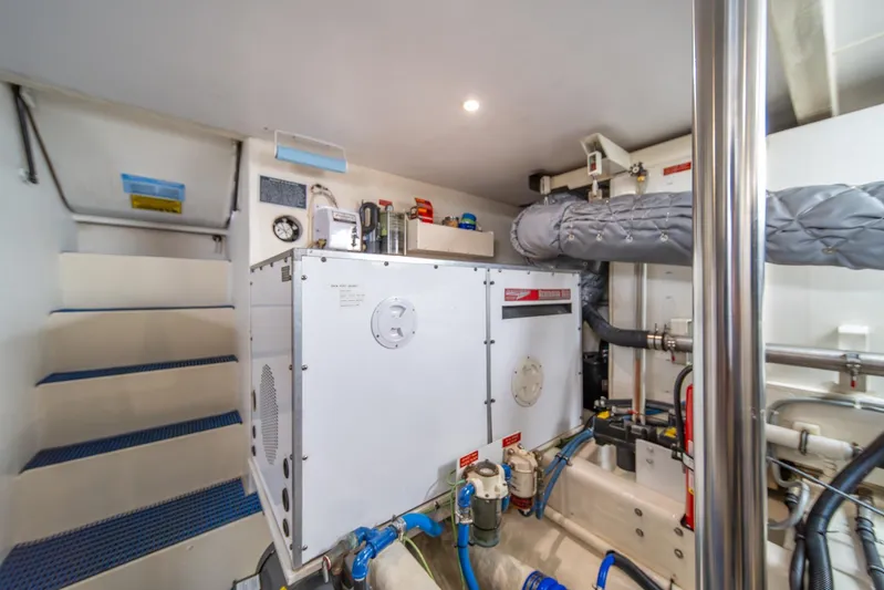 Esperanca Yacht Photos Pics Engine room of 1998 West Bay 58 Sonship Pilothouse MY with equipment and piping.