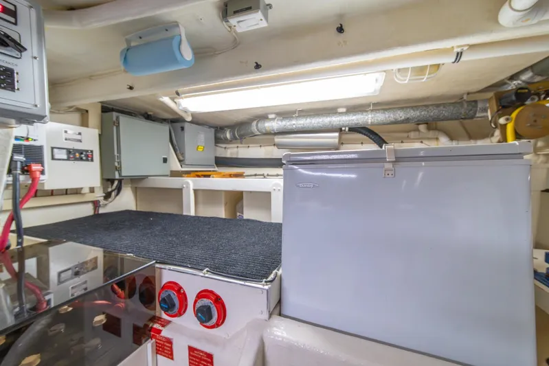 Esperanca Yacht Photos Pics Engine room of 1998 West Bay 58 Sonship Pilothouse MY with equipment and storage.