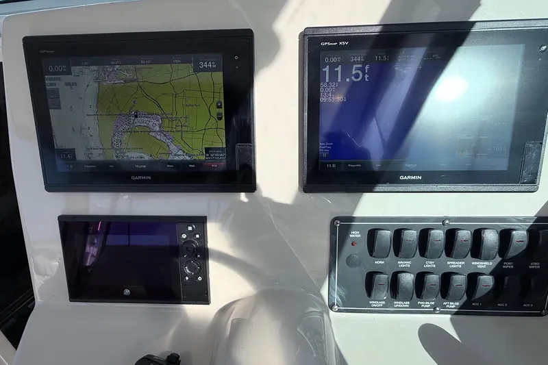  Yacht Photos Pics Control panel of a 2018 Boston Whaler 315 Conquest with Garmin navigation displays.