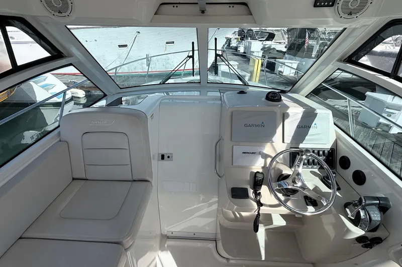  Yacht Photos Pics 2018 Boston Whaler 315 Conquest helm with Garmin navigation and Mercury controls.