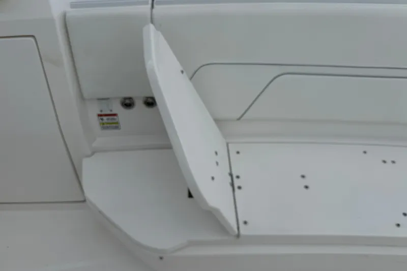  Yacht Photos Pics 2019 Intrepid 345 Nomad FE boat seat with storage compartment open.