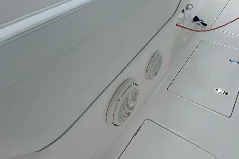  Yacht Photos Pics 2019 Intrepid 345 Nomad FE boat interior with speakers and storage compartments.