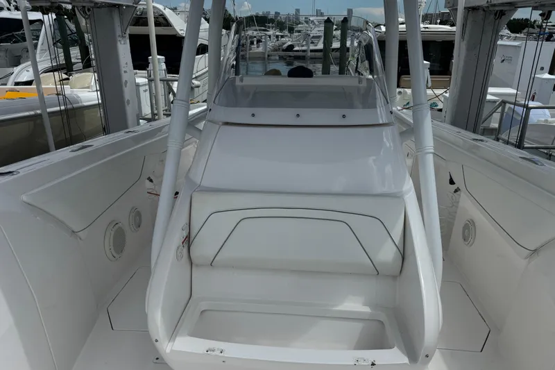  Yacht Photos Pics 2019 Intrepid 345 Nomad FE boat interior with sleek white design and seating.