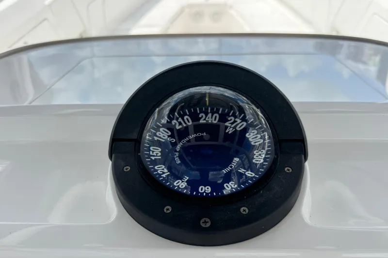  Yacht Photos Pics Compass on 2019 Intrepid 345 Nomad FE boat dashboard, showing navigation directions.