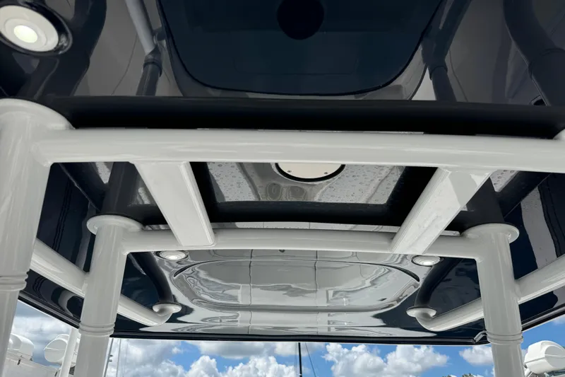  Yacht Photos Pics 2019 Intrepid 345 Nomad FE boat roof structure with sleek design and lighting.