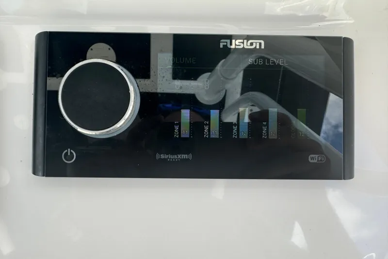  Yacht Photos Pics Fusion audio control panel on 2019 Intrepid 345 Nomad FE boat, featuring volume and zone settings.